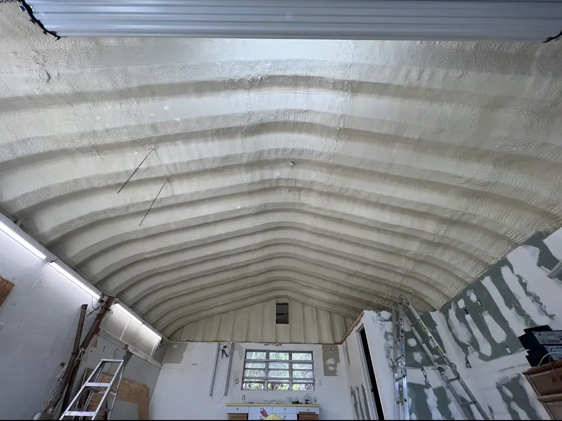 Spray polyurethane foam applied to the underside of a metal roof deck in Redlands